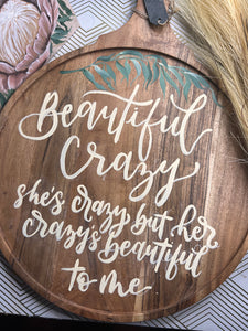 Breadboard hand painted with leaf stem.  Brush lettered with Song Lyrics. Beautiful Crazy